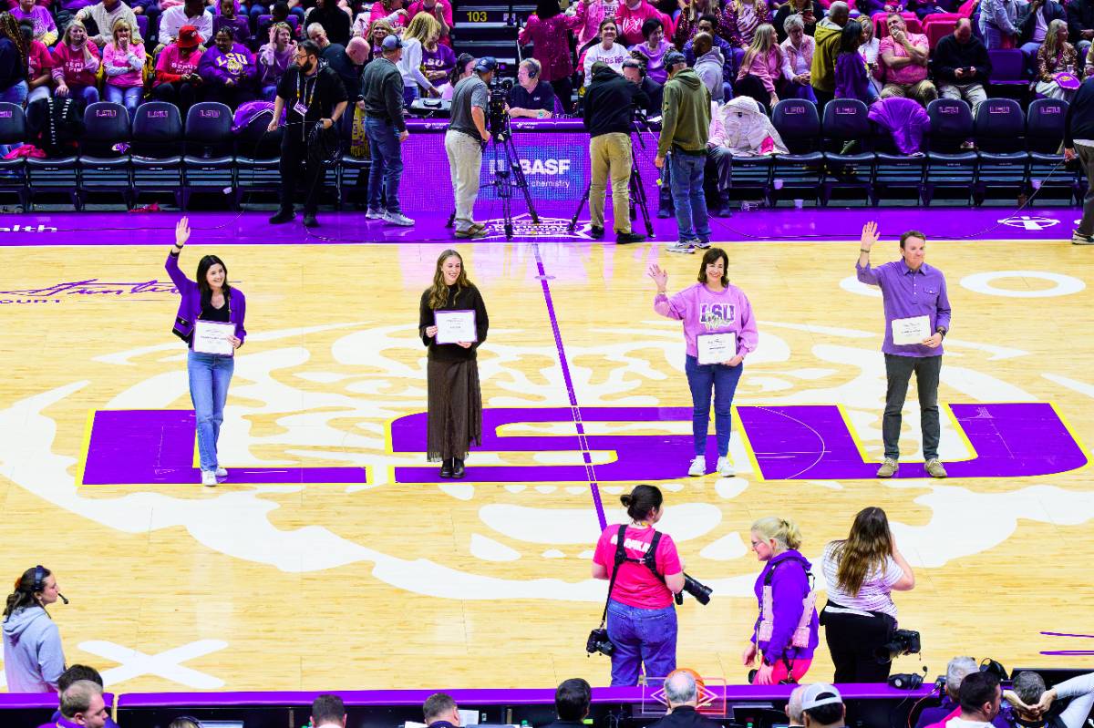 Four LSU employees were honored for their work at an LSU Women's Basketball Game