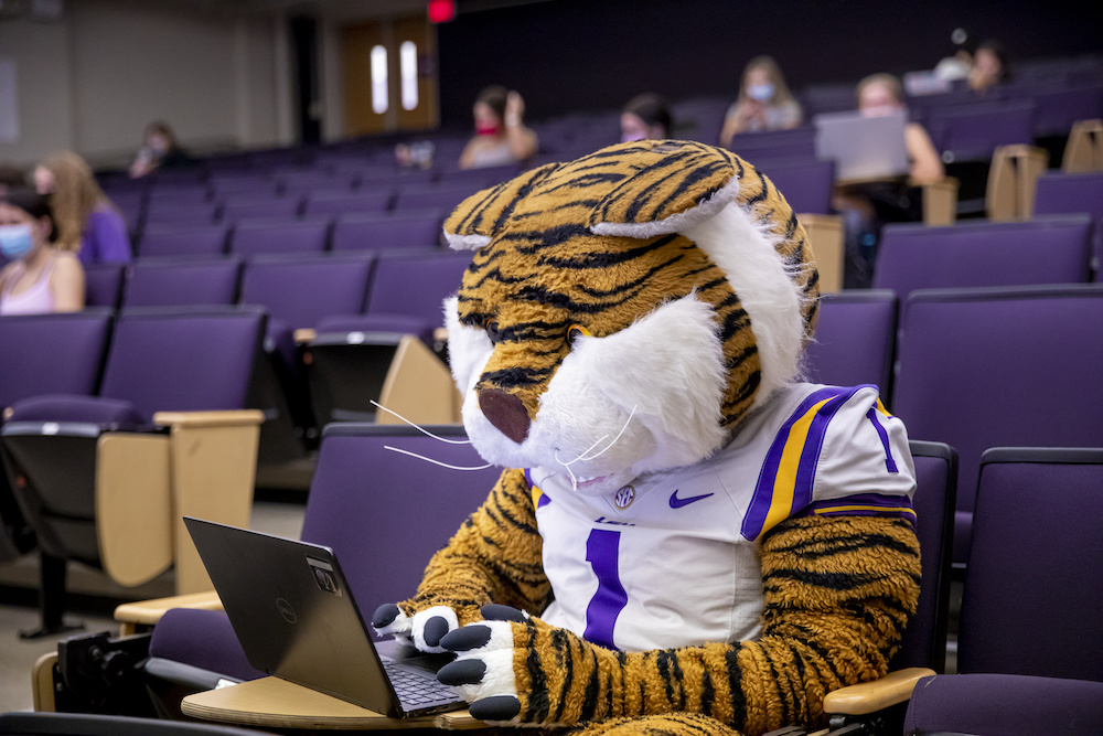 mascot mike the tiger on a laptop