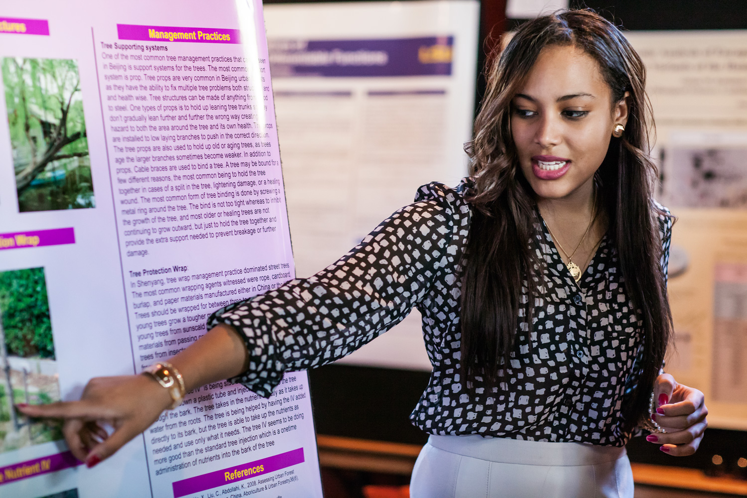  photo: student presenting about research